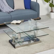 Table basse avec plateaux pivotants en verre et métal chromé